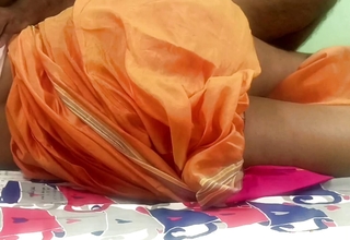 Indian traditional married women orange colour saree bed romance