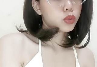 Glasses student squeezes small
