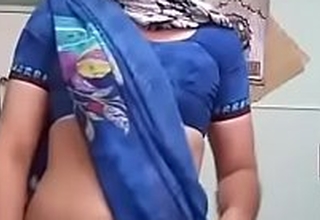 indian crossy showing off beside saree