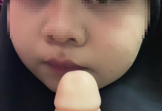 Hijabi malay sucking dildo