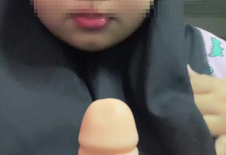 Hijabi malay sucking dildo