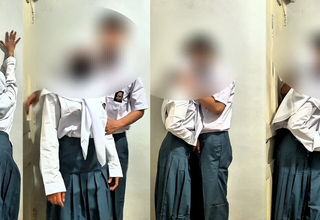 Passionate schoolgirl with hijab strokes her boyfriend’s thick flannel behind dusty warehouse shelves.