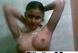 Indian legal age teenager takes a shower enhanced at the end of one's tether receives clothed
