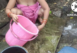 Indian house wife rinse outside
