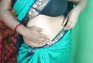 Indian horny maw Striping in green sharee and showing her cum-hole closeup