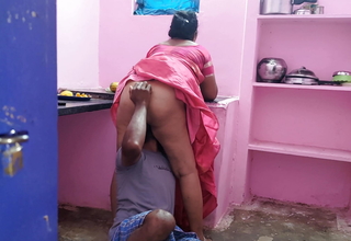 Aunty was searching for a fallen mango in a difficulty kitchen together with I went behind her together with grabbed her rear together with licked her pussy wit